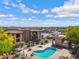 Overhead view of community pool and spa area with lounge chairs at a multi-Gathering residential complex at 537 S Delaware Dr # 224, Apache Junction, AZ 85120