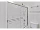 Clean, white tiled shower and tub combo with glass sliding door and updated fixtures at 537 S Delaware Dr # 224, Apache Junction, AZ 85120