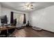 Bedroom with a ceiling fan, hardwood floors, and a window for natural light at 6207 N 21St Dr, Phoenix, AZ 85015