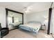 Cozy bedroom featuring a blue metal bed frame, large mirror, and neutral carpet at 6207 N 21St Dr, Phoenix, AZ 85015