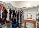 Walk-in closet featuring shelving, hanging rods and a small dressing table with mirror at 6207 N 21St Dr, Phoenix, AZ 85015