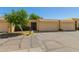 Exterior view of a single-story home with a two-car garage and well-maintained landscaping at 6207 N 21St Dr, Phoenix, AZ 85015