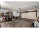 Spacious garage offering plenty of room for parking and storage with lighting and automatic door at 6207 N 21St Dr, Phoenix, AZ 85015