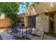 Cozy outdoor patio area, perfect for relaxation, featuring ample space and a wrought iron patio set at 6207 N 21St Dr, Phoenix, AZ 85015