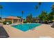 Inviting community pool with plenty of space for swimming, sunbathing and relaxing with lounge chairs at 6207 N 21St Dr, Phoenix, AZ 85015