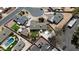 Aerial view of a home with a backyard pool and well-manicured landscaping at 654 W Plata Ave, Mesa, AZ 85210