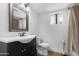 Bathroom featuring a vanity, toilet, mirror, and shower with curtain at 654 W Plata Ave, Mesa, AZ 85210