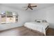 Bedroom featuring wood-look flooring and a large window that provides natural light at 654 W Plata Ave, Mesa, AZ 85210