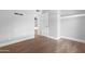 Empty bedroom with tile floors and a doorway leading to another room at 654 W Plata Ave, Mesa, AZ 85210