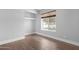 Empty bedroom with a closet and a window with wooden blinds at 654 W Plata Ave, Mesa, AZ 85210
