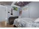 Bedroom decorated with dark furniture, ceiling art, and posters covering the walls at 654 W Plata Ave, Mesa, AZ 85210