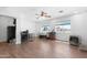 Bright bonus room with two large windows and wood-look tile flooring at 654 W Plata Ave, Mesa, AZ 85210