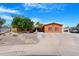 Charming single-story home with a well-manicured yard and an expansive driveway at 654 W Plata Ave, Mesa, AZ 85210