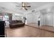 Open concept living room with views of the kitchen featuring tile flooring and a ceiling fan at 654 W Plata Ave, Mesa, AZ 85210
