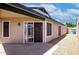 Back patio features a concrete slab and sliding glass doors, perfect for outdoor living at 7045 S 42Nd St, Phoenix, AZ 85042