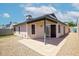 Inviting back patio with sliding glass doors and well-maintained landscaping at 7045 S 42Nd St, Phoenix, AZ 85042