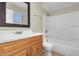 Bathroom with single sink vanity, framed mirror and shower over tub and tiled flooring at 7045 S 42Nd St, Phoenix, AZ 85042