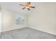 Cozy bedroom with carpet flooring, neutral walls, and a window for natural light at 7045 S 42Nd St, Phoenix, AZ 85042