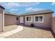 Home exterior showcasing a walkway, desert landscaping, and neutral color scheme, creating a welcoming curb appeal at 7045 S 42Nd St, Phoenix, AZ 85042