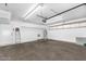 Spacious two-car garage is equipped with shelving and lighting for optimal organization and functionality at 7045 S 42Nd St, Phoenix, AZ 85042