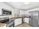 Bright kitchen featuring stainless steel appliances, tiled floors, and white cabinetry at 7045 S 42Nd St, Phoenix, AZ 85042
