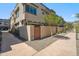 Townhome exterior with private entry and xeriscape landscaping with gated front patio area at 7464 E Paraiso Dr, Scottsdale, AZ 85255