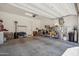 Spacious garage with ample storage and a clean, painted floor provides lots of room at 7464 E Paraiso Dr, Scottsdale, AZ 85255