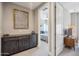 Hallway view into the bedroom, featuring a storage console, modern decor, and interior doorways at 7464 E Paraiso Dr, Scottsdale, AZ 85255