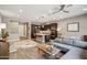 Bright, open-concept kitchen and living room with modern finishes and recessed lighting at 7464 E Paraiso Dr, Scottsdale, AZ 85255