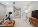 Open living room with a staircase, television, modern decor, and lots of light at 7464 E Paraiso Dr, Scottsdale, AZ 85255