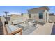Spacious roof deck is designed for lounging with plush couches, patterned rug, and overhead heating at 7464 E Paraiso Dr, Scottsdale, AZ 85255