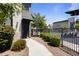 Charming home exterior with a landscaped walkway leading to the front door and community pool view at 7531 E Billings St # 116, Mesa, AZ 85207