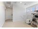 Upstairs hallway with neutral carpeting, recessed lighting and an adjacent cat play area at 7531 E Billings St # 116, Mesa, AZ 85207