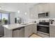 Modern kitchen with stainless steel appliances, subway tile backsplash, and quartz countertops at 7531 E Billings St # 116, Mesa, AZ 85207