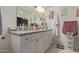 Bathroom showcasing a white vanity with granite counters and ample storage at 8111 E Jerome Ave, Mesa, AZ 85209
