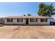 Charming single-story home featuring a well-maintained lawn and inviting entrance at 8111 E Jerome Ave, Mesa, AZ 85209