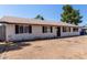 Well-maintained single-story home with drought tolerant landscaping at 8111 E Jerome Ave, Mesa, AZ 85209