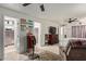 Large main bedroom with dual ceiling fans, a walk-in closet, and an ensuite bathroom at 8111 E Jerome Ave, Mesa, AZ 85209
