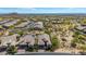 Aerial view of a Primary-planned community showcasing the beautiful desert landscape and mountain views at 9059 E Leonora St. St, Mesa, AZ 85207