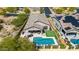 This private backyard boasts a pool, putting green, patio, and lush landscaping perfect for relaxation and entertainment at 9059 E Leonora St. St, Mesa, AZ 85207