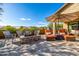 This backyard features a pool, seating around a fire pit, and an outdoor dining area at 9059 E Leonora St. St, Mesa, AZ 85207
