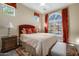 Comfortable bedroom with cozy decor, warm lighting, and a well-coordinated color scheme for a relaxing ambiance at 9059 E Leonora St. St, Mesa, AZ 85207