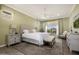 Well-lit bedroom featuring soft colors, ample natural light, and coordinated furnishings for a serene retreat at 9059 E Leonora St. St, Mesa, AZ 85207
