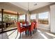 Well-lit dining room with a large sliding glass door to an outdoor seating area for an seamless indoor/outdoor living experience at 9059 E Leonora St. St, Mesa, AZ 85207