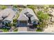 Attractive home featuring desert landscaping, tile roof, and brick paver driveway, complemented by mature trees at 9059 E Leonora St. St, Mesa, AZ 85207