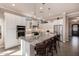 Spacious kitchen with granite island, stainless appliances, breakfast bar, and stylish pendant lighting at 9059 E Leonora St. St, Mesa, AZ 85207