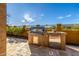 Outdoor kitchen with stainless steel grill and appliances for effortless outdoor dining and entertaining at 9059 E Leonora St. St, Mesa, AZ 85207