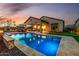 Stunning backyard pool with outdoor kitchen, lounge area and putting green overlooking the desert landscape at 9059 E Leonora St. St, Mesa, AZ 85207
