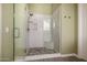 Contemporary shower featuring glass doors, stone accents, and modern fixtures for a luxurious feel at 9059 E Leonora St. St, Mesa, AZ 85207