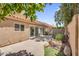 Spacious backyard featuring a block wall, mature shade trees and large patio at 9223 E Camino Del Santo --, Scottsdale, AZ 85260